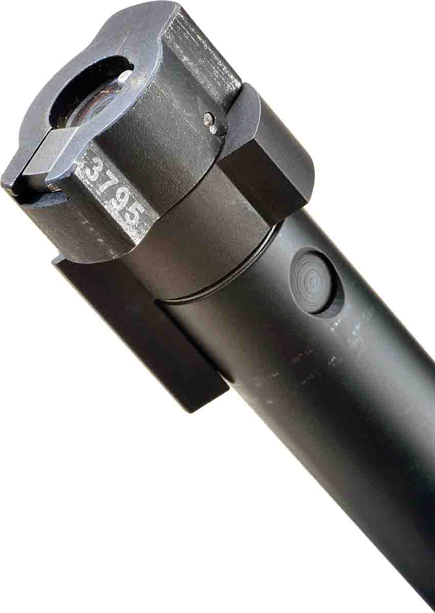 The bolt is made for heavy-duty use. A sliding extractor and spring-type ejector are located on the bolt face. Note the serial number stamped on the lugs.